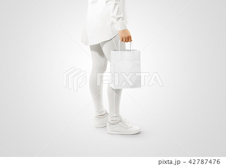 Blank white craft paper bag design mockup holding hand 42787476