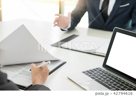 young man explaining about his profile to business managers sitt young man explaining about his profile to business managers sitt 42794616