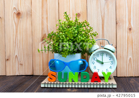 SUNDAY letters text and notebook paper, clock 42795015