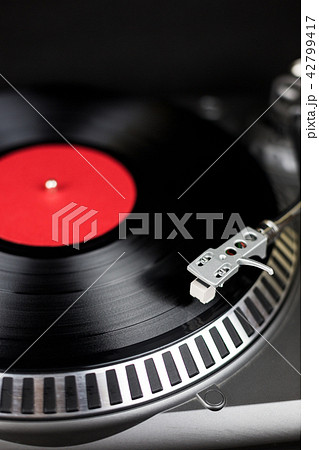 Close-up of Professional party djs turntable. Analog stage audio equipment for concert in nightclub Close-up of Professional party djs turntable. Analog stage audio equipment for concert in nightclub 42799417