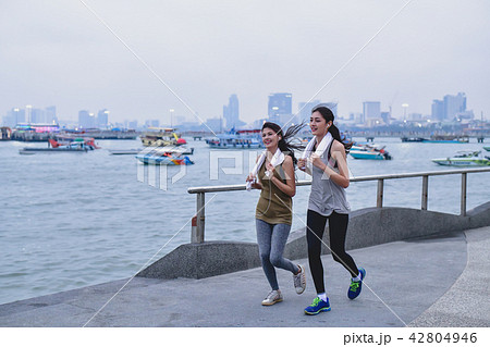 Sports concept. Beautiful girl is exercising on the beach with r 42804946