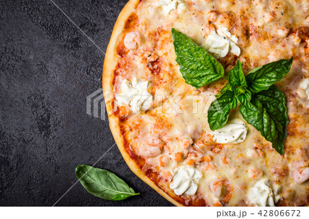 Pizza with seafood shrimps and salmon 42806672