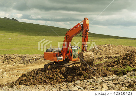 excavator at work in the mountain landscape.. 42810423