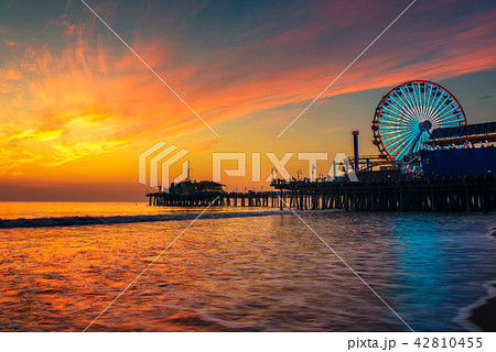 Visitors enjoy sunset above Santa Monica Pier in Los Angeles Visitors enjoy sunset above Santa Monica Pier in Los Angeles 42810455