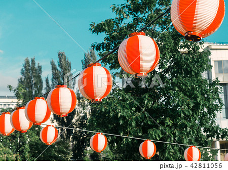 Paper red-white japanese lanterns Chochin hanging on blue sky background 42811056