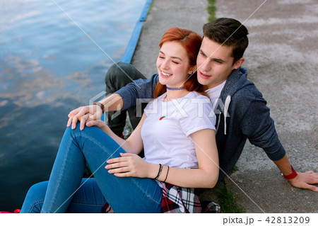 Happy nice couple being near the water 42813209