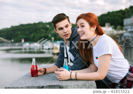 Joyful young people talking to each other Joyful young people talking to each other 42813322