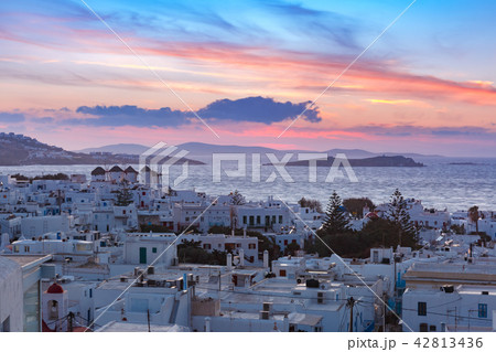 Traditional white windmills at sunset, Mykonos, Greece Traditional white windmills at sunset, Mykonos, Greece 42813436