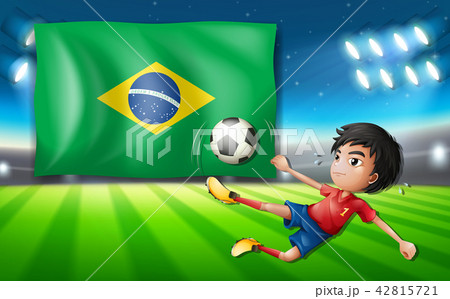 Boy soccer player infront of brazil flag 42815721