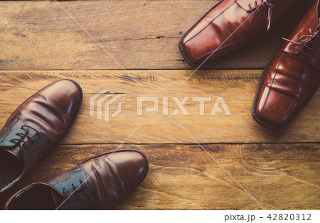 Leather shoes on the wooden floor. 42820312