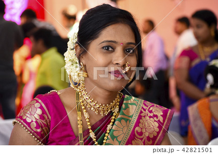 Woman dressed in Indian attire at wedding ceremony Woman dressed in Indian attire at wedding ceremony 42821501