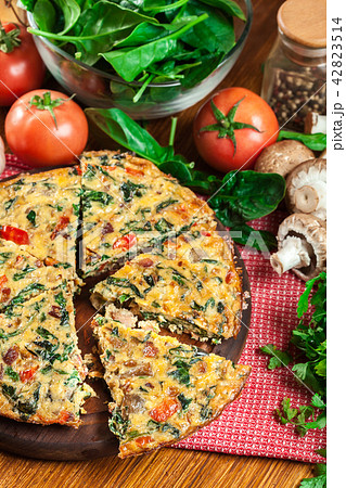 Frittata made of eggs, mushrooms and spinach Frittata made of eggs, mushrooms and spinach 42823514