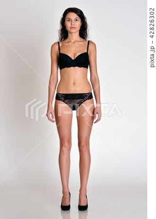 Woman in underwear full lengh in front position Woman in underwear full lengh in front position 42826302