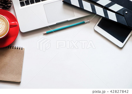office stuff with Movie clapper laptop and coffee  42827842