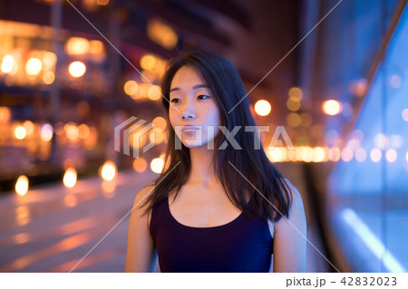 Portrait Of Beautiful Asian Woman Thinking Outdoors At Night 42832023
