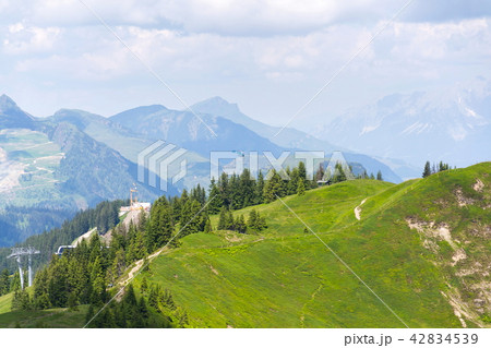 Blue helicopter flying over Alps Saalbach, Austria Blue helicopter flying over Alps Saalbach, Austria 42834539