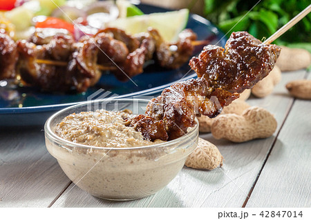 Traditional pork satay with peanut sauce Traditional pork satay with peanut sauce 42847014