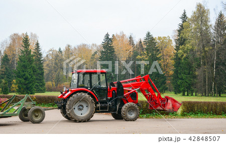 A farm vehicle working at autumn park A farm vehicle working at autumn park 42848507