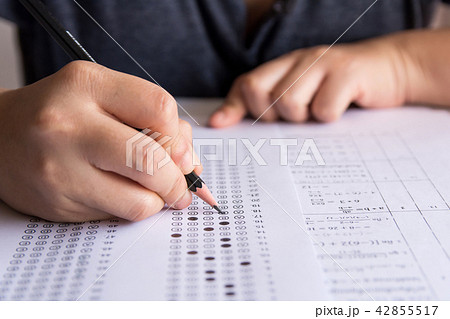 Students hand holding pencil writing selected Students hand holding pencil writing selected 42855517