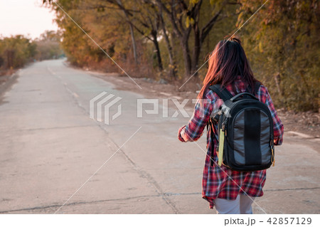 Traveling woman with backpack walk Traveling woman with backpack walk 42857129
