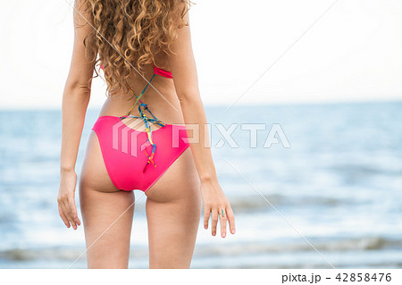 Happy young woman at beach in summer vacation. 42858476