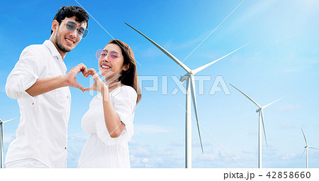 Happy couple making heart sign gesture with hands. Happy couple making heart sign gesture with hands. 42858660
