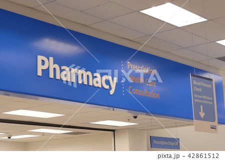 Close up of pharmacy sign hanging on store 42861512