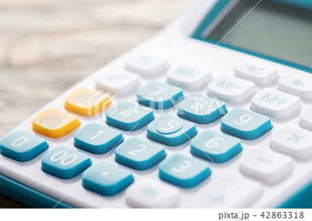 calculator on wood table. calculator on wood table. 42863318
