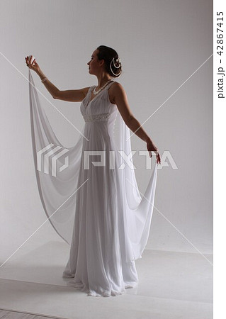the bride in a dress in Greek style. the bride in a dress in Greek style. 42867415