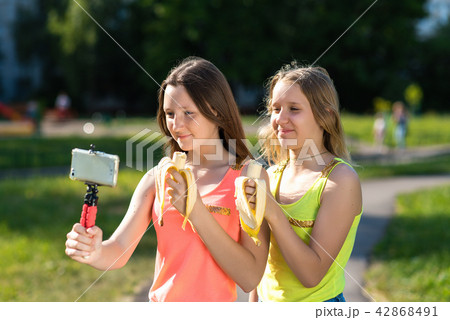 Where little girls are schoolgirls. In summer in the park in his hands he keeps bananas. Records 42868491