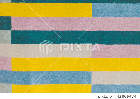 Colorful carpet with hand made graphic pattern 42869474