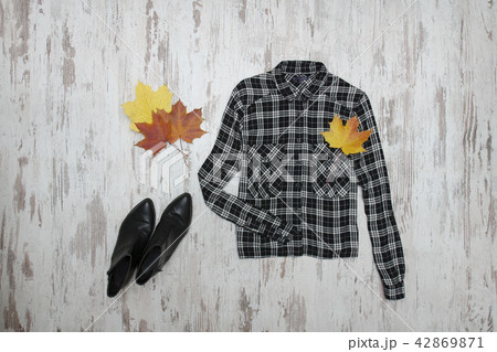 Black checkered shirt and maple leaves Black checkered shirt and maple leaves 42869871