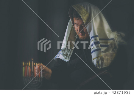 Hanukkah, a Jewish celebration. Candles burning  42871955
