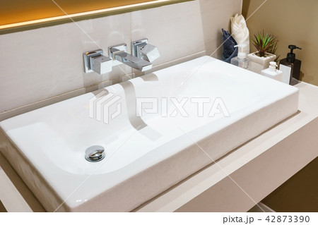 Interior of bathroom with sink basin faucet Interior of bathroom with sink basin faucet 42873390