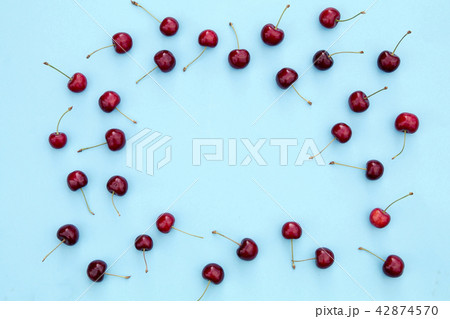 Fresh sweet cherries on blue background 42874570