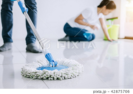 Housekeeping and cleaning concept, Young couple in blue rubber g 42875706