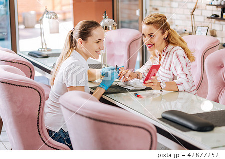 Beautiful mature woman going to nail bar 42877252