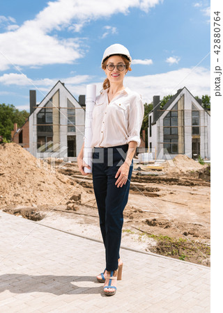 Professional positive architect standing at the construction site 42880764