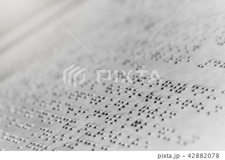 Close up braille text writing on iron plate background 42882078