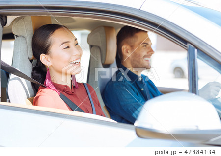 Positive nice couple sitting in the car Positive nice couple sitting in the car 42884134