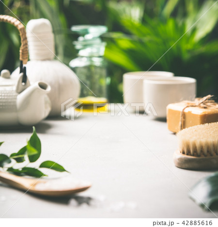 Tea composition on tropical leaves background 42885616
