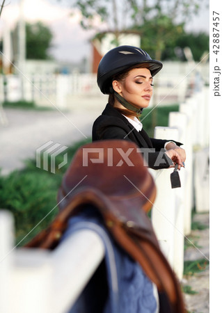 elegant rider woman in helmet with whip elegant rider woman in helmet with whip 42887457