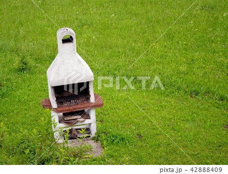 white brick oven in green spring field garden 42888409