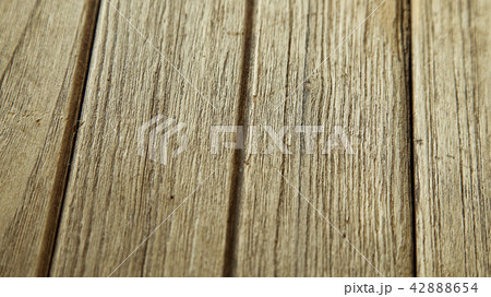 Closeup on wooden board background Closeup on wooden board background 42888654