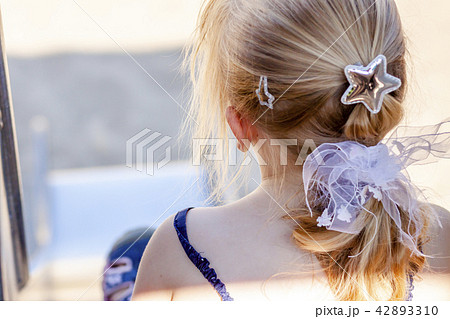 Cute little girl having fun on slide at a playground outdoors in summer Cute little girl having fun on slide at a playground outdoors in summer 42893310