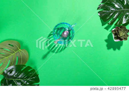 Workspace frame with green tropical leaf and cup Workspace frame with green tropical leaf and cup 42893477