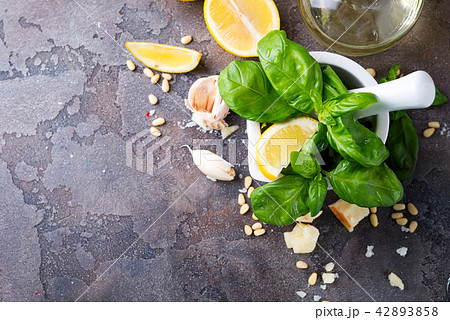Ingredients for making pesto sauce on a stone Ingredients for making pesto sauce on a stone 42893858