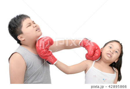 Brother and sister fighting with red boxing gloves Brother and sister fighting with red boxing gloves 42895866