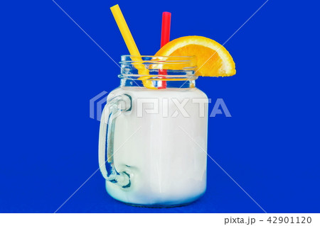 Mixed berry smoothie on blue background Mixed berry smoothie on blue background 42901120