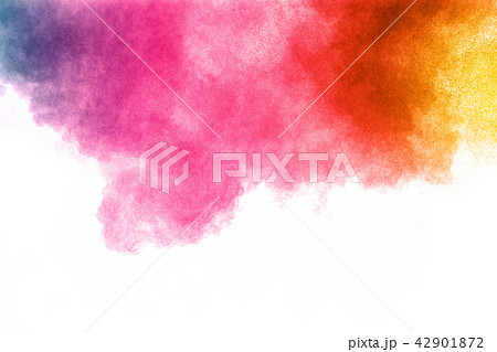 abstract color powder explosion on white. 42901872